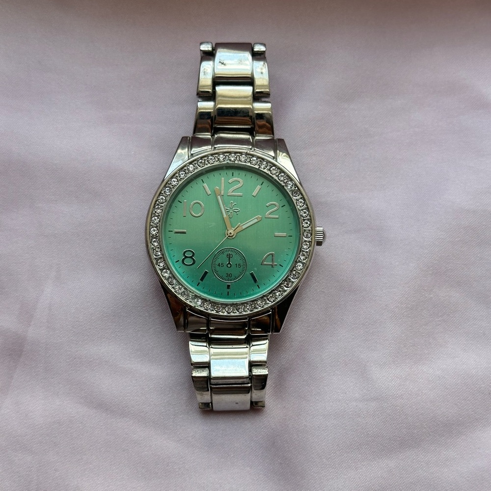 Silver Icing Watch with turquoise face and diamond encrusted.